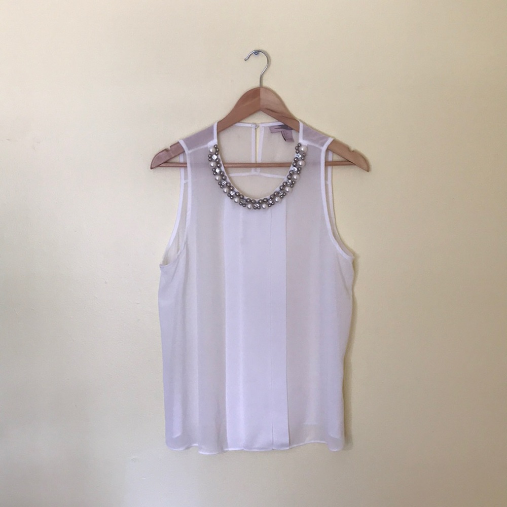 Sleeveless White Blouse with Stunning Collar